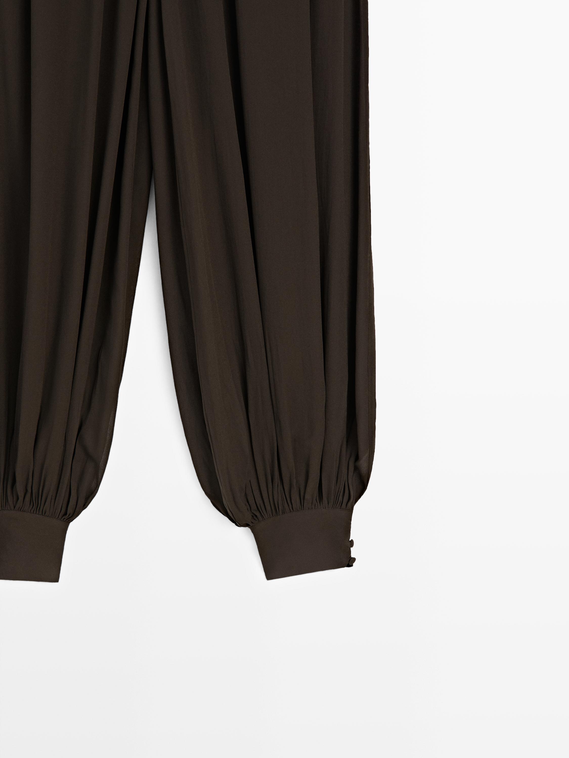 Pantalon bouffant semi-transparent avec boutons